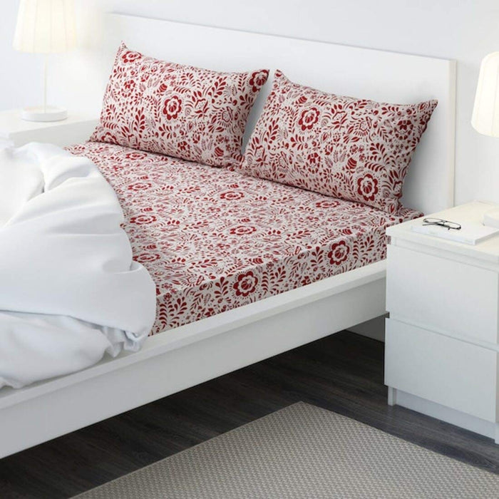 red cotton flat sheet and 2 pillowcase set from IKEA on a bed  40494293