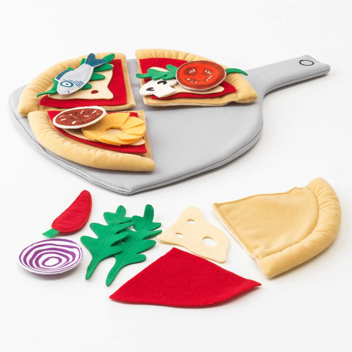 A child's play kitchen with the IKEA Toy Pizza Set on display.