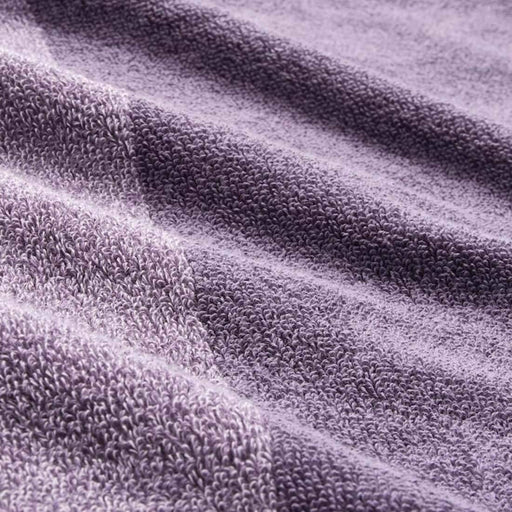 A close-up image of an IKEA hand towel in Lilac/mélange with a soft and absorbent surface 60442806