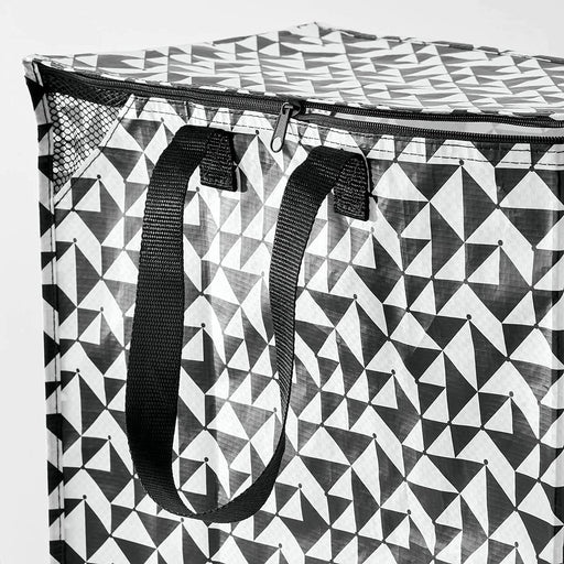 Close-up of IKEA KNALLA black white patterned bag showing sturdy handles and zip closure