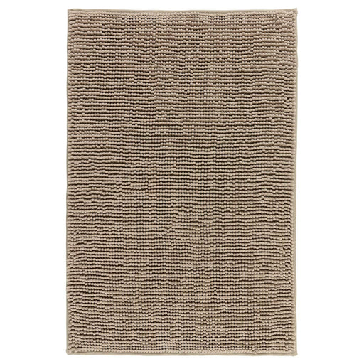 Beige bath mat from IKEA with plush texture and anti-slip backing for added safety and comfort 80242420