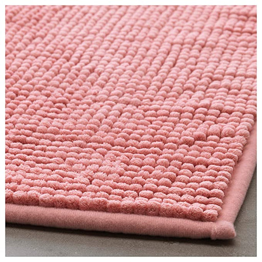 Thick and luxurious pink bath mat from IKEA, with a plush texture that provides comfort and warmth to your feet after a shower or bath 40422277