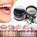 A person smiling with a bright, white smile after using the bamboo charcoal teeth whitening powder.