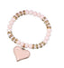 A close-up of a trendy, Women Heart Pendant Bracelets Bling Crystal Beads Charming Bracelets Jewelry