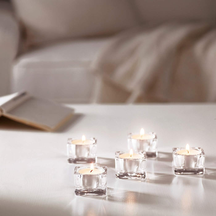 Add a touch of glamour to your home décor with this stylish tealight holder from IKEA. Its shiny metallic finish will catch the eye of any visitor 20290126