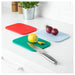 A flexible silicone cutting board with a textured surface, ideal for preparing dough or rolling out pastry.