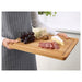 A functional kitchen accessory, an IKEA bamboo chopping board that's both stylish and practical.