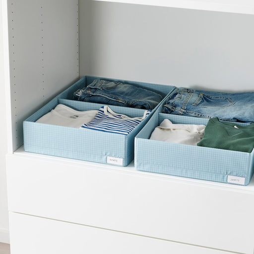 A box with compartments designed for storing clothes such as jeans, and shirts. Featuring a  design for easy visibility of stored items.  70493918