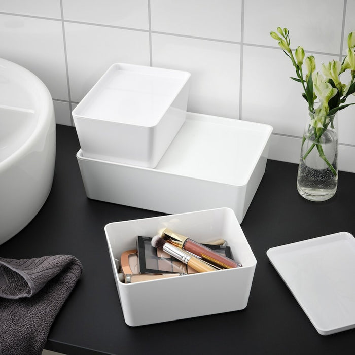 A rectangular box with a removable lid, featuring a stackable design and a simple, functional style suitable for various storage needs.