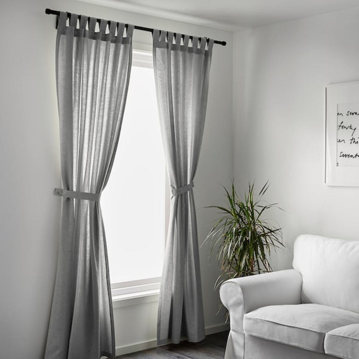 Add some sophistication to your windows with these grey IKEA curtains, which come in a pair and include tie-backs. Dimensions are 140x150 cm."