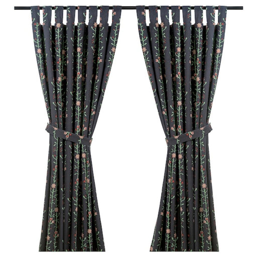 A pair of multicolored curtains with tie-backs, suitable for standard-sized windows.