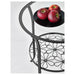 A sleek black side table with a clear glass top, sitting on four legs. It has a modern and minimalist design. 20161558