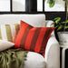 Multiple IKEA cushion covers in different colors and designs on a sofa- 70495272