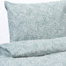 A close-up shot of IKEA's duvet cover in a soft white/Blue color with matching pillowcases   20392865