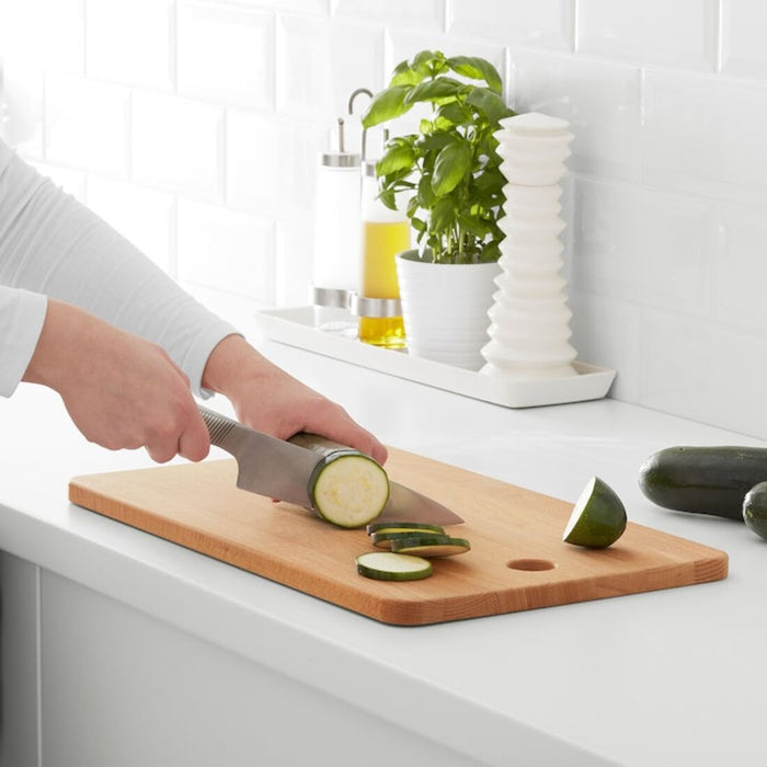 An IKEA cutting board made of durable polypropylene, featuring a textured surface that prevents knives from slipping, making it safe and efficient for cutting and chopping.60300350