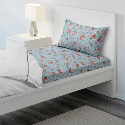 Turquoise cotton flat sheet and pillowcase from IKEA on a bed 80494309