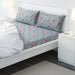 Turquoise cotton flat sheet and 2 pillowcase set from IKEA on a bed  20494939