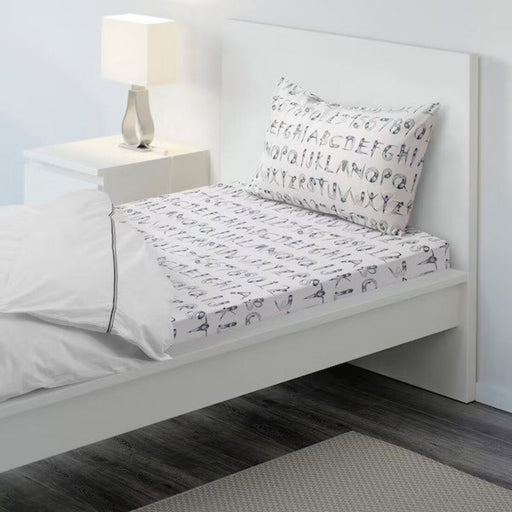 Cotton flat sheet and pillowcase from IKEA on a bed  40454782