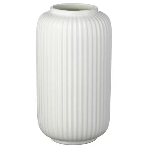 A sleek white IKEA vase with a narrow neck and flared base, perfect for holding a single stem or a small bouquet of flowers.
