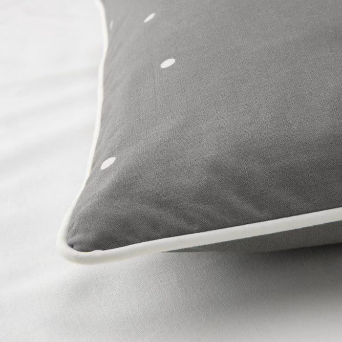A close-up shot of IKEA's pillowcase in a soft Grey  color, dot pattern  40488937