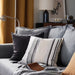 Multiple IKEA cushion covers in different colors and designs on a sofa-20513631