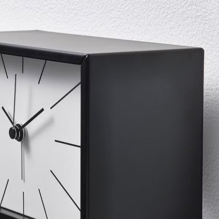 An elegant alarm clock with a sleek metallic finish 10511388