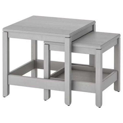 "A set of two white nesting tables from IKEA, featuring clean lines and a modern design.