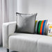 Multiple IKEA cushion covers in different colors and designs on a sofa-30281145