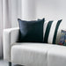 Multiple IKEA cushion covers in different colors and designs on a sofa-60281139