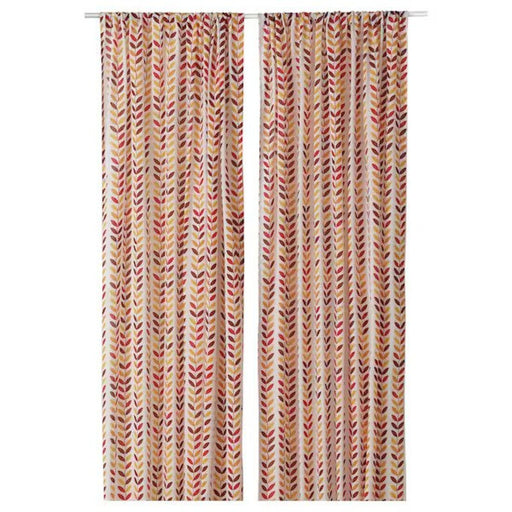  IKEA curtain with floral pattern, hanging from a rod.