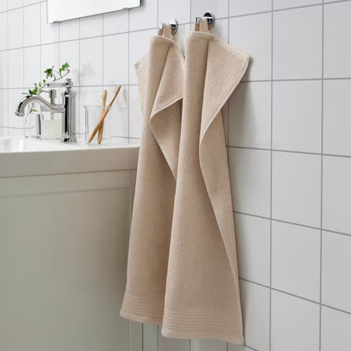 A classic Light grey/beige hand towel with a simple and elegant border design, perfect for any bathroom 60508326 