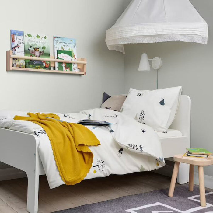 A cozy-looking bed with a colorful duvet cover and matching pillowcase from IKEA   00504699 