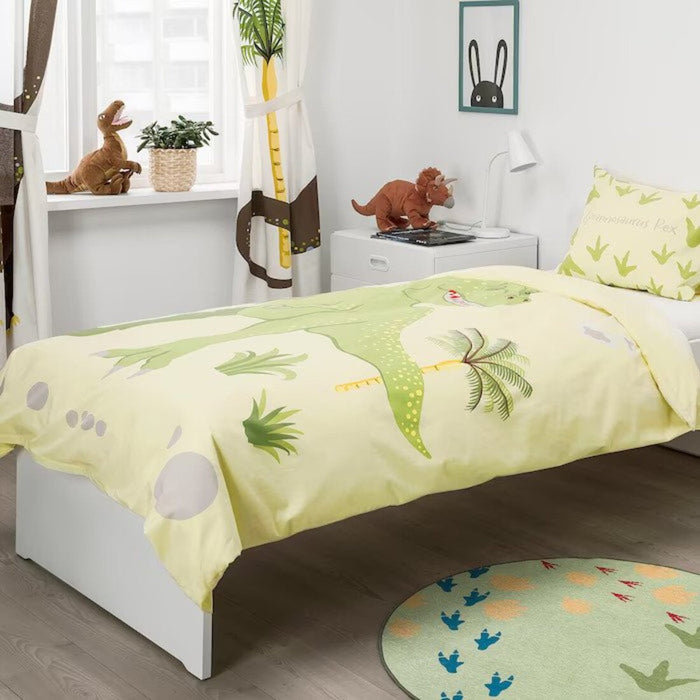 A cozy-looking bed with a colorful duvet cover and matching pillowcase from IKEA 40488937  60464110 