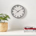 A round wall clock with a bold, graphic design 40511834