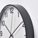 A metal wall clock with a vintage, industrial look  40511834