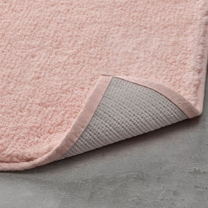 Pale-pink bathmat is designed to keep you safe and secure while getting ready in the bathroom 40511363
