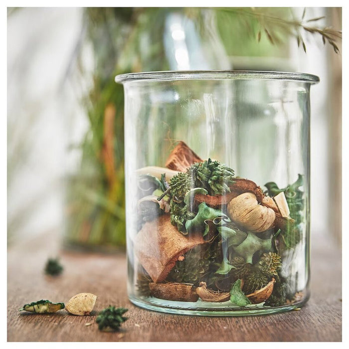 A glass filled with natural-scented potpourri made of dried flowers  80502757
