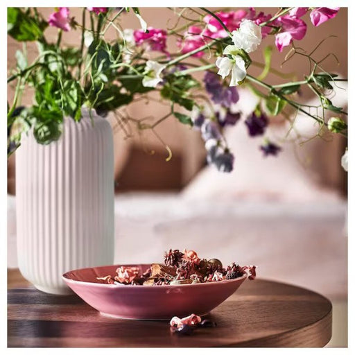 A bowl filled with natural-scented potpourri made of dried flowers  60502763