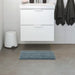 IKEA bath mat placed on a bathroom floor, featuring a soft and absorbent texture and a non-slip bottom for secure footing 80526536