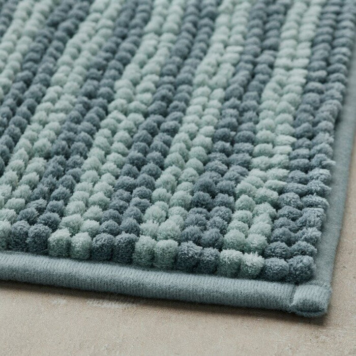Thick and luxurious blue bath mat from IKEA, with a plush texture that provides comfort and warmth to your feet after a shower or bath 80526536