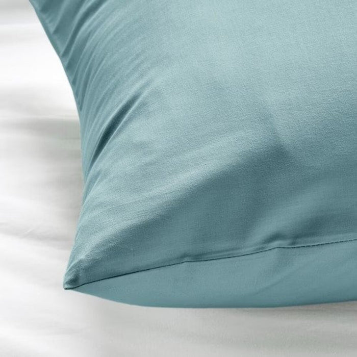 The edge of a blue pillowcase from IKEA, highlighting its bright and cheerful color  50501698  