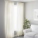 White IKEA single track rail holding curtains in living room 00492917