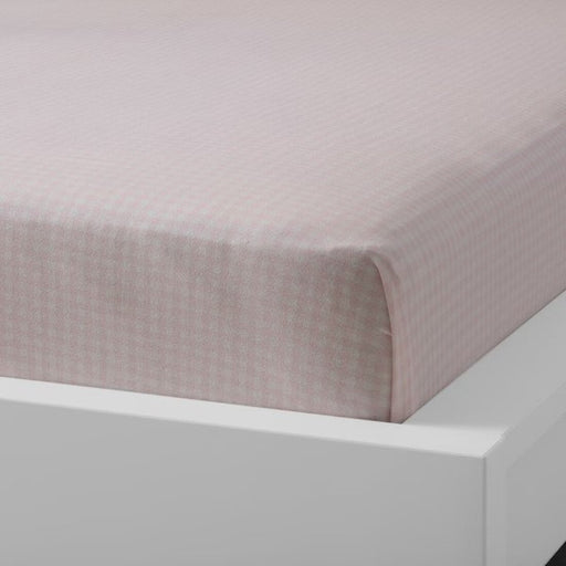 Pink cotton flat sheet and pillowcase from IKEA draped on a bed  40454796 