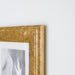 A modern gold photo frame with a minimalist design, ideal for showcasing your art or photography  40378514
