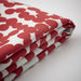 A closeup photo of an Ikea cushion cover red/dot patternThe color stays fresh for longer as the fabric is fade resistant.-40509874