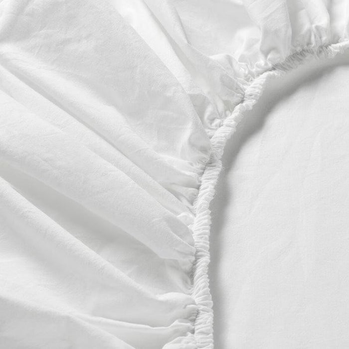 A close-up of an IKEA fitted sheet's elastic edges shows its stretchiness and durability  10357221