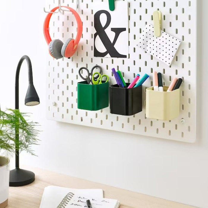 A stack of IKEA pegboard containers in various sizes and colors, showcasing the brand's versatile storage options for different needs and preferences. 50518707