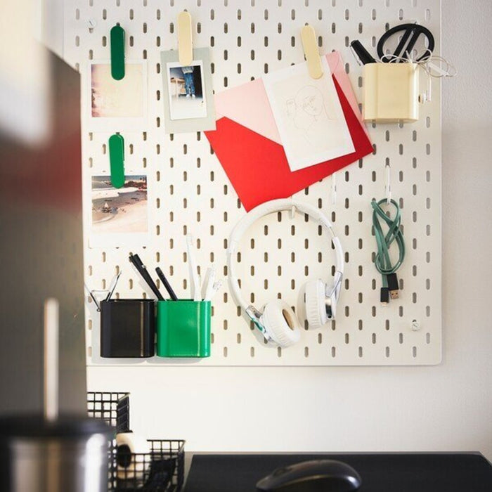 An organized workspace with IKEA pegboard containers holding different tools and supplies, highlighting the brand's practical and efficient storage solutions 50518707