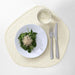 A round, natural-looking IKEA place mat made of sustainable materials 90531556