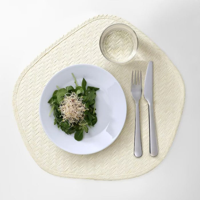 A patterned IKEA place mat in shades of gray and white, ideal for a modern and minimalist table setting. 90531556